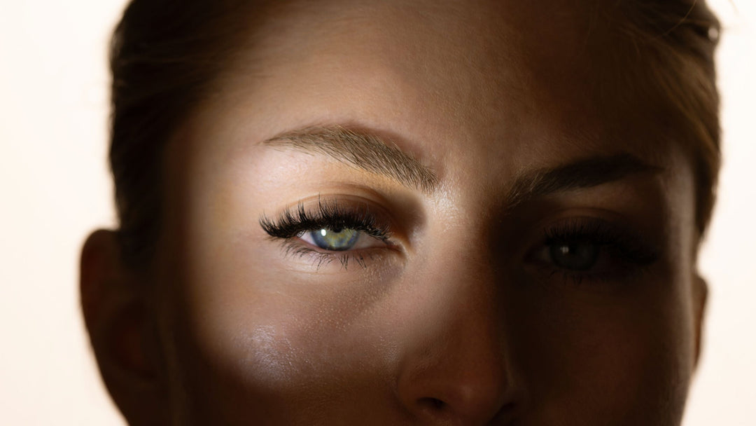 Eyelash extension on woman with shadow over eye at Lash Affair