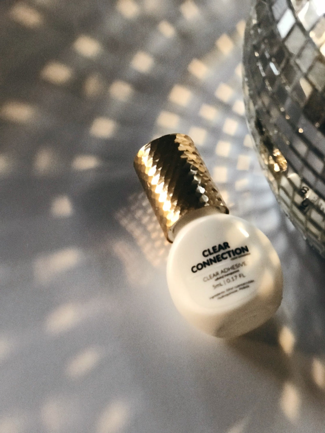 Clear connection bottle with disco ball