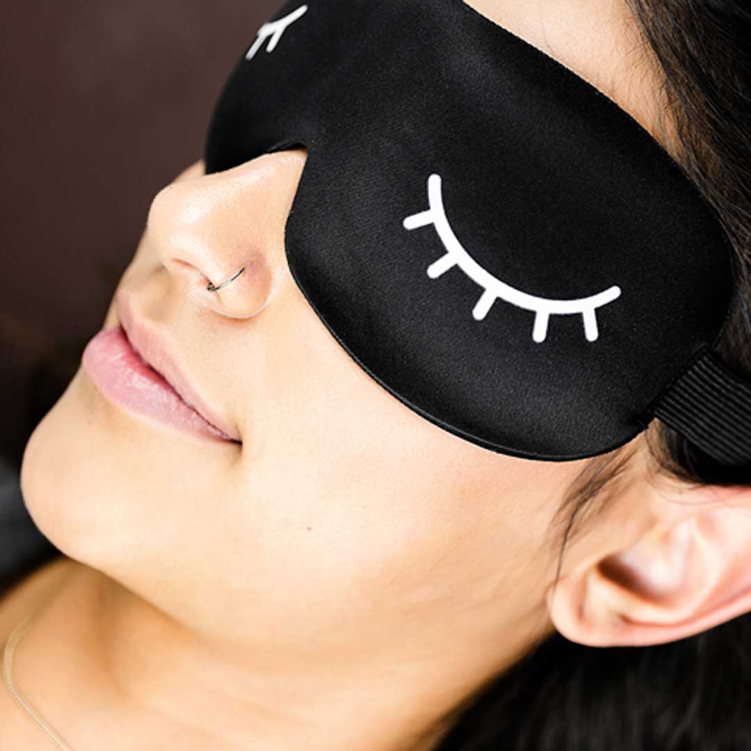 girl wearing a nightime sleep mask by lash affair